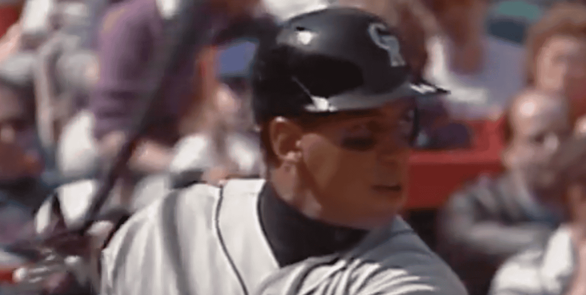 Andres Galarraga hitting a home run, showcasing his impact at Coors Field.